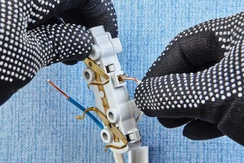 Installing of new wall socket. Stock Photos