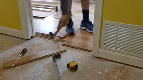 Installing oak flooring in new construction 4K Stock Footage 118902931