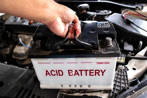 Installing or replacement acid battery in vehicle Stock-Fotos