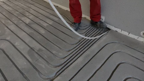 Installing Pipe Tube for Floor Heating Isolation Follow Shot Stock Footage 109107785
