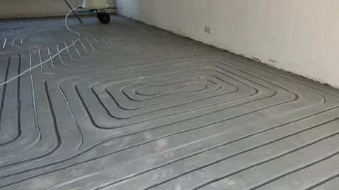 Installing Pipe Tube for Floor Heating Isolation on For Ground Stock Footage 109107795