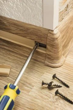 Installing plinth at corner of room Stock Photos