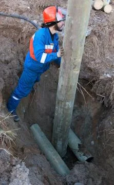 Installing a power pole in the pit Stock Photos