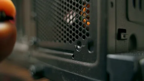 Installing the power supply in the system unit of the computer. Stock Footage 121703498