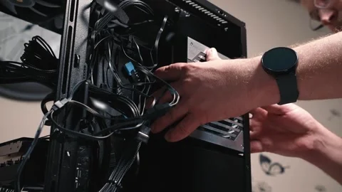 Installing power supply unit into computer case and securing it with screws Stock Footage 335072145