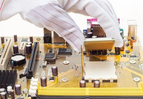 Installing a processor in computer motherboard Stock Photos