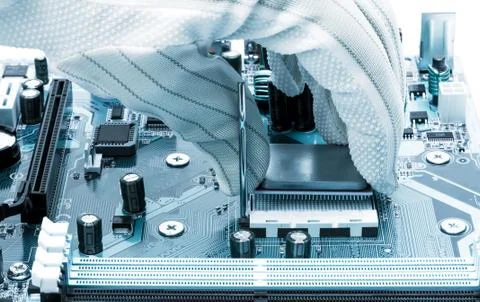 Installing a processor in computer motherboard Stock Photos