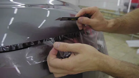 Installing protection film Stock Footage 146117181