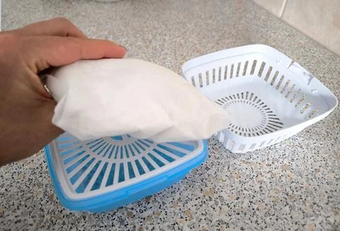 Installing a replacement unit in a portable dehumidifier for the home Stock Photos