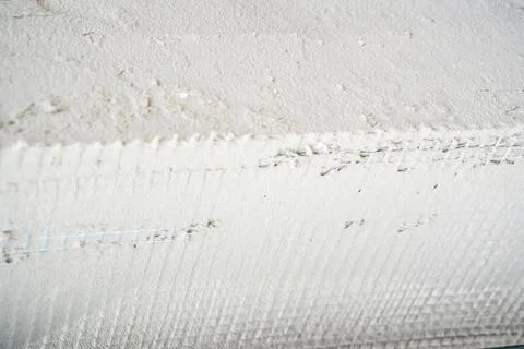 Installing rigid styrofoam insulation board for energy saving of the house wall Stock Photos