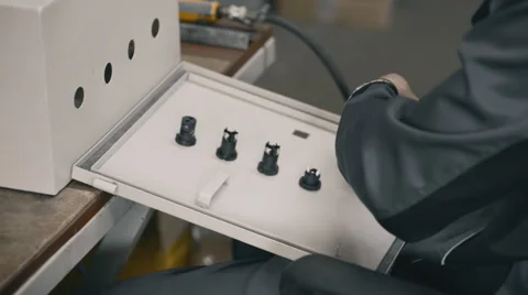 Installing a sealing strip to the door of electrical cabinet Hands of Vidéo 57522442