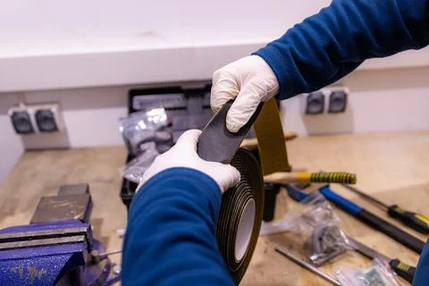 Installing Self Adhesive Cable Duct Cover Strip, Preparing Cable Management Chan Foto stock