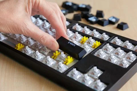 Installing Shift Key During Computer Keyboard Reassembly and Repair 库存照片