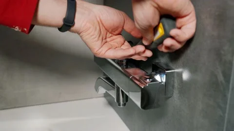 Installing a shower faucet in the bathroom.. Video stock 138631395