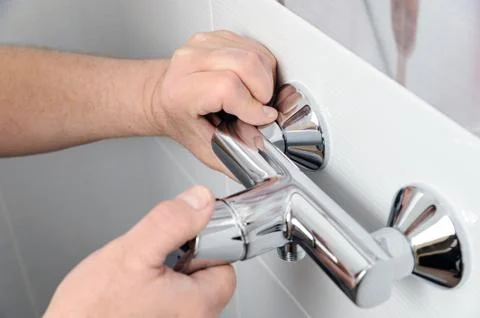 Installing a shower faucet. Stock Photos