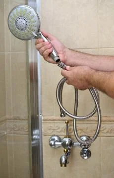 Installing a shower hose Stock Photos