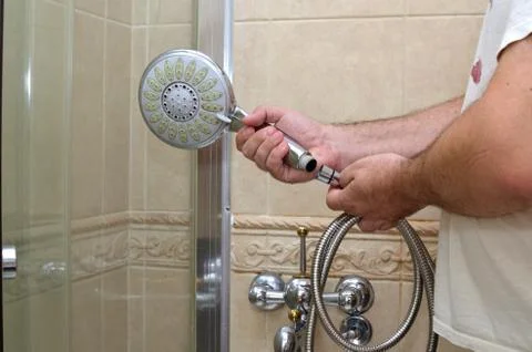 Installing a shower hose Stock Photos