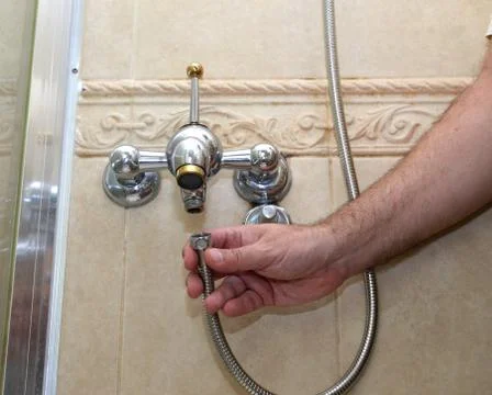 Installing a shower hose Stock Photos