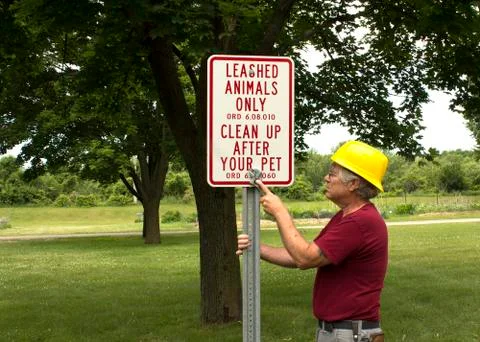 Installing a sign Photos