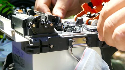 Installing the sleeve onto a fiber optic cable Stock-Footage 123586684