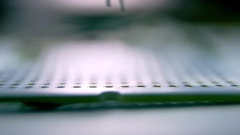 Installing of small led bulb on green panel with pincers Stock Footage 246666703