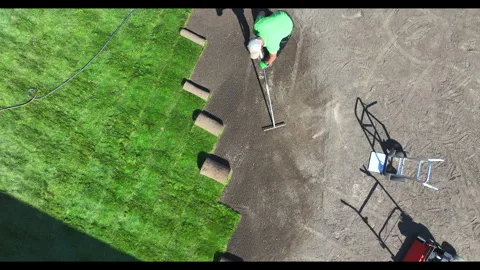 Installing Sod Rolls on a New Lawn Stock-Footage 276691427