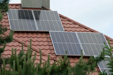 Installing a Solar Cell on a Roof. Stock Photos