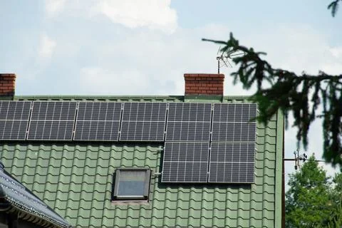 Installing a Solar Cell on a Roof. Stock Photos