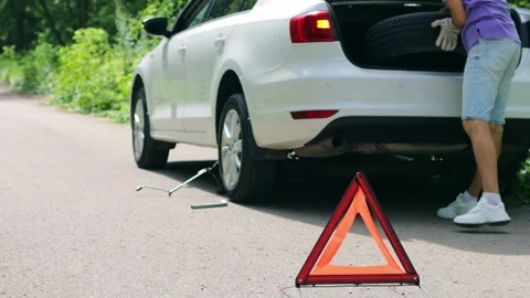 Installing the spare wheel of the car. Stock Footage 246955674