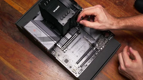 Installing an SSD into a desktop motherboard. Ideal for tech setup tutorials. Stock Footage 301636765