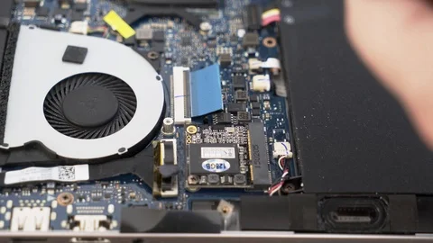 Installing the SSD Disk into the msata slot on the laptop. Installing a hard Stock Footage 87648394