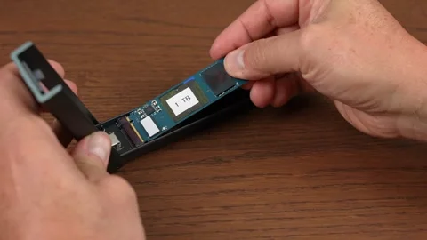 Installing an SSD Drive into Enclosure Stock Footage 289468849