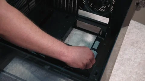 Installing standoffs for motherboard mounting inside PC case Stock Footage 324593315