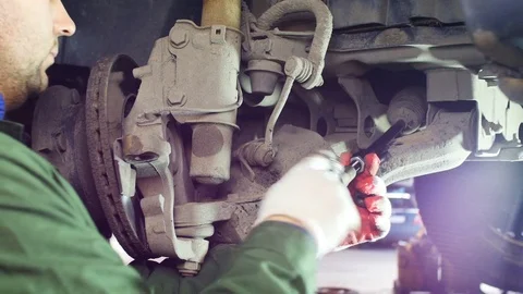 Installing the suspension element on the truck Stock Footage 72114300