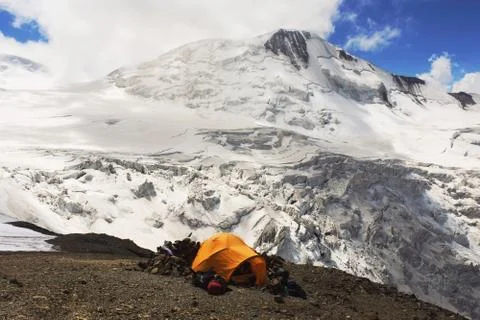Installing a Tent in the mountains highlands Stock Photos