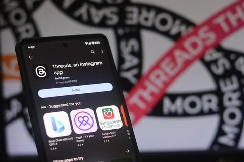 Installing Threads app on a phone, The threads logo is displayed on a smart.. Stock Photos
