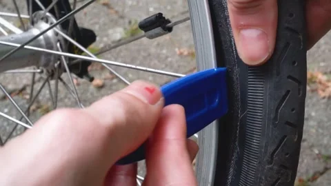 Installing Tire Lever on Bike Stock Footage 276423804