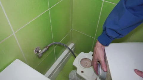 Installing a toilet cistern Stock Footage 330239035