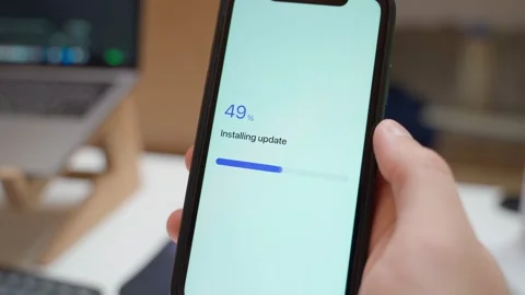 Installing update progress on smartphone screen. Update failed error message Stock Footage 343237713