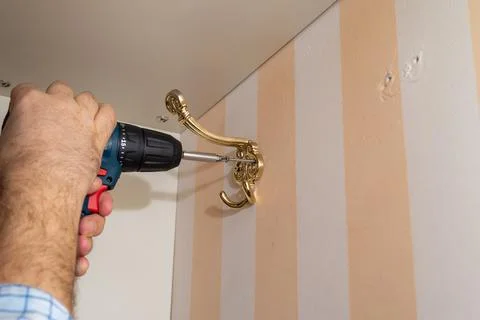 Installing a wardrobe hook Stock Photos