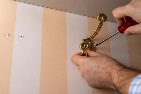 Installing a wardrobe hook Stock Photos