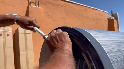 Installing a Water Heater Fitting with a Wrench Stock Footage 345209906