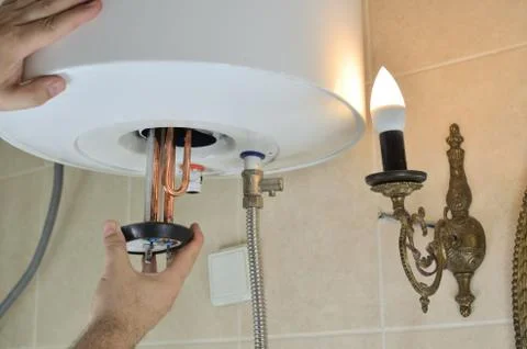 Installing a water heater Stock Photos