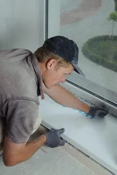 Installing window sill Stock Photos