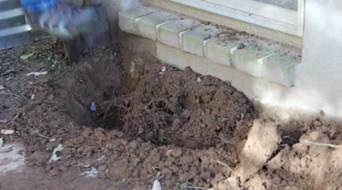 Installing a window well cu Stock Footage 45431798