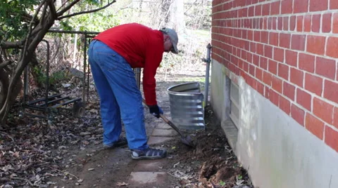 Installing a window well medium wide shot Stock Footage 45431860