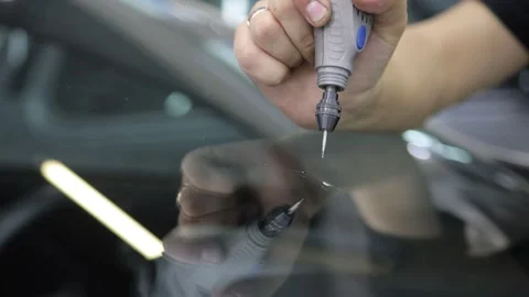 Installing windshield on a car with automotive design Stock Footage 286159929
