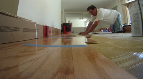 Installing wood floors time lapse home repair remodeling construction work Stock Footage 24042220