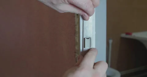 Installing a wooden door lock. Stock Footage 306854714
