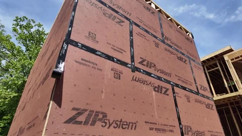Installing Zip System Plywood for Enhanced Weather Resistance in Construction Stock Footage 280218306